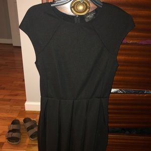 A cute form fitting at the top black dress